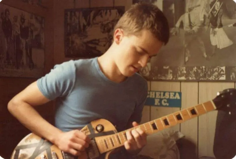 Al Gregg - practising on a luxurious Kay guitar in his penthouse suite